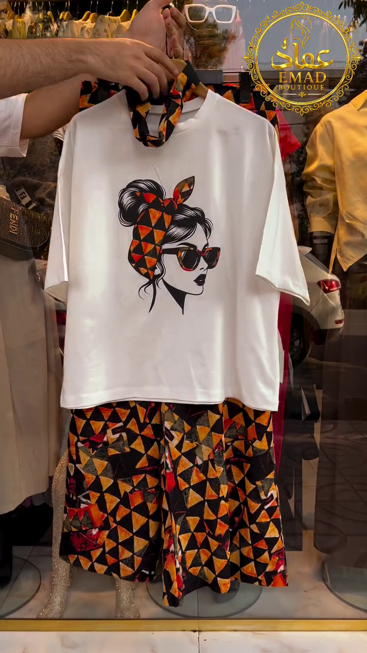 🖤 Chic White Graphic T-Shirt with Artistic Face Print Paired with Patterned Ethnic Short
