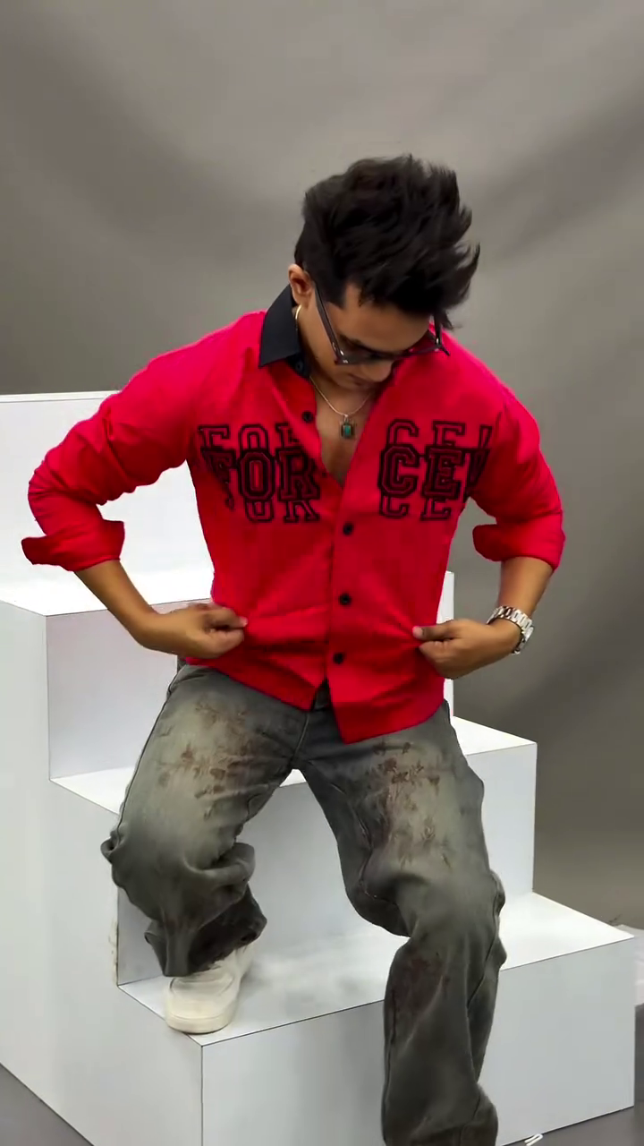 Men's Vibrant Red Button-Down Casual Shirt Featuring Contrasting Black Lapel Collar, Bold Typographic Chest Embroidery, and Distressed Wash Denim Pants