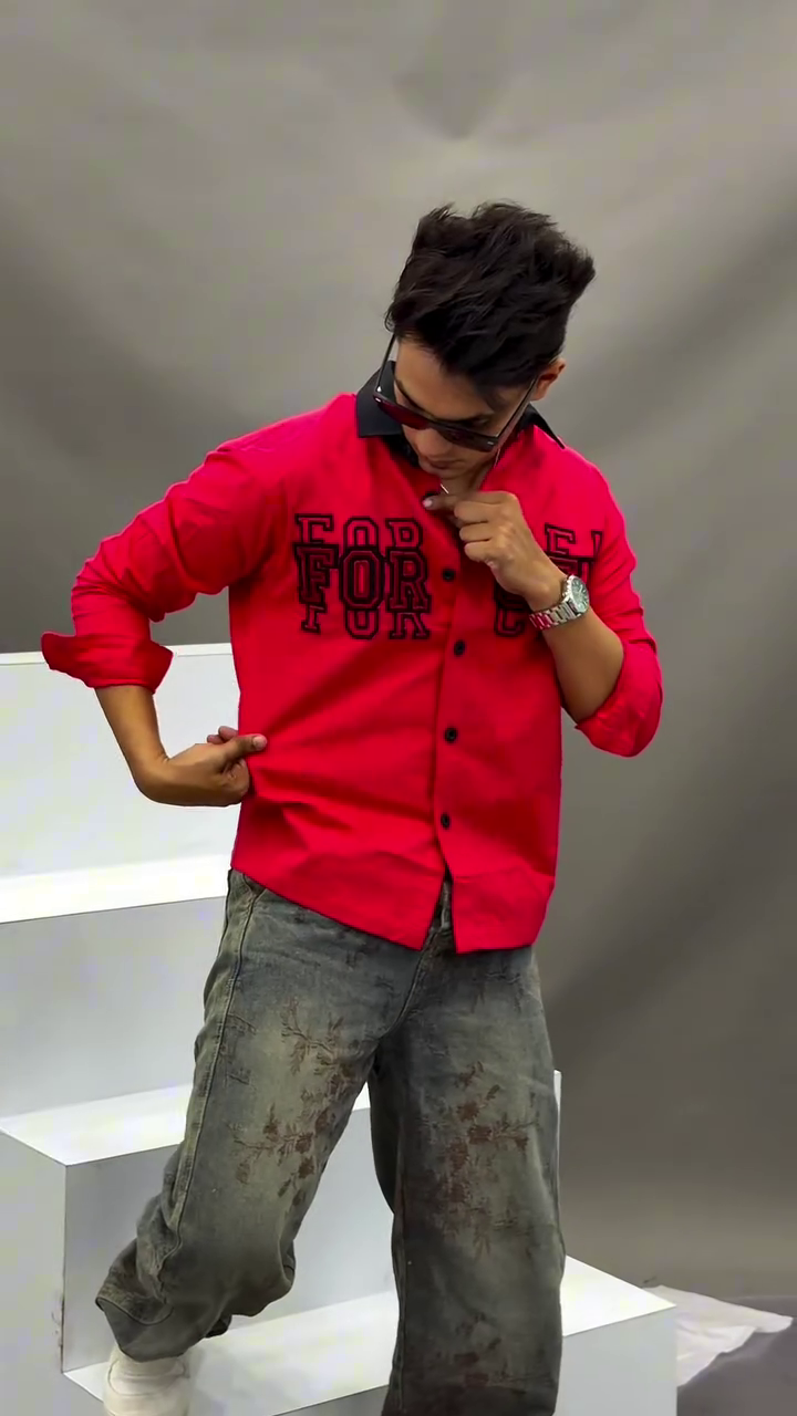 Men's Vibrant Red Button-Down Casual Shirt Featuring Contrasting Black Lapel Collar, Bold Typographic Chest Embroidery, and Distressed Wash Denim Pants