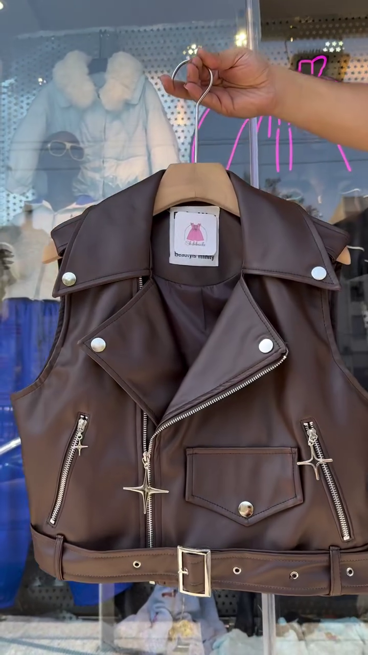 Chic Dark Brown Faux Leather Biker Vest Featuring Asymmetric Silver-Tone Zippers, Studded Lapels, and an Adjustable Buckled Hem Belt