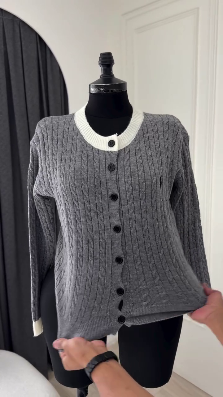 Elegant Grey Double-Breasted Knit Two-Piece Sweater Set Featuring a Short Capelet Overlay with Gold-Toned Metallic Buttons and a Matching Ribbed Long-Sleeve Under Top