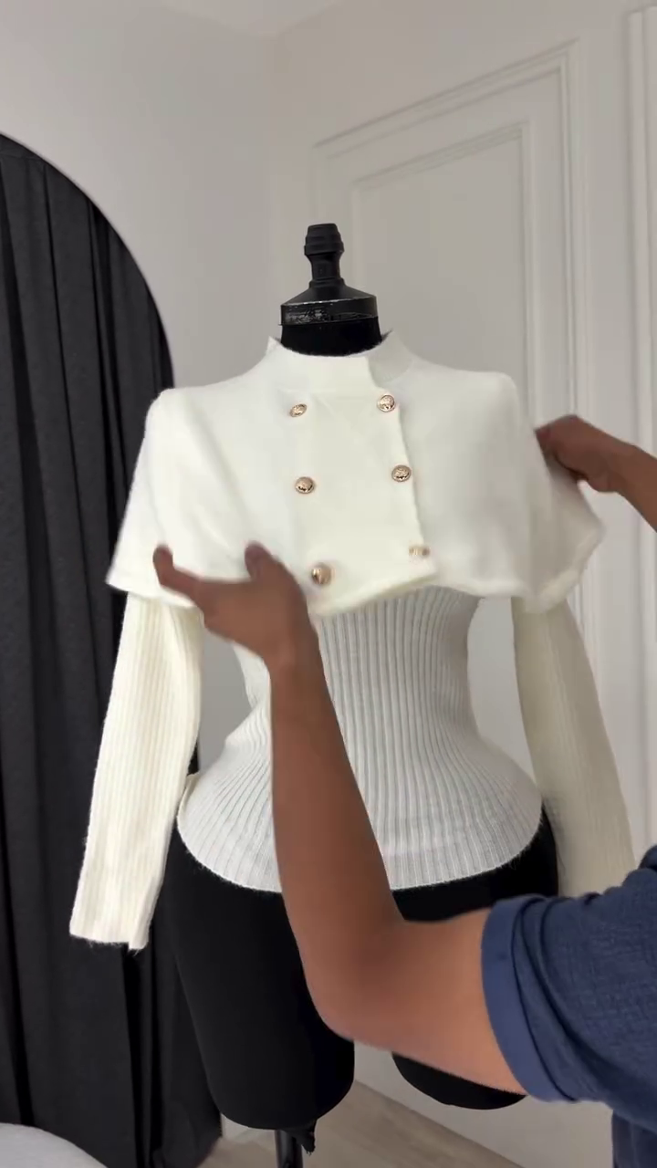 Elegant Grey Double-Breasted Knit Two-Piece Sweater Set Featuring a Short Capelet Overlay with Gold-Toned Metallic Buttons and a Matching Ribbed Long-Sleeve Under Top
