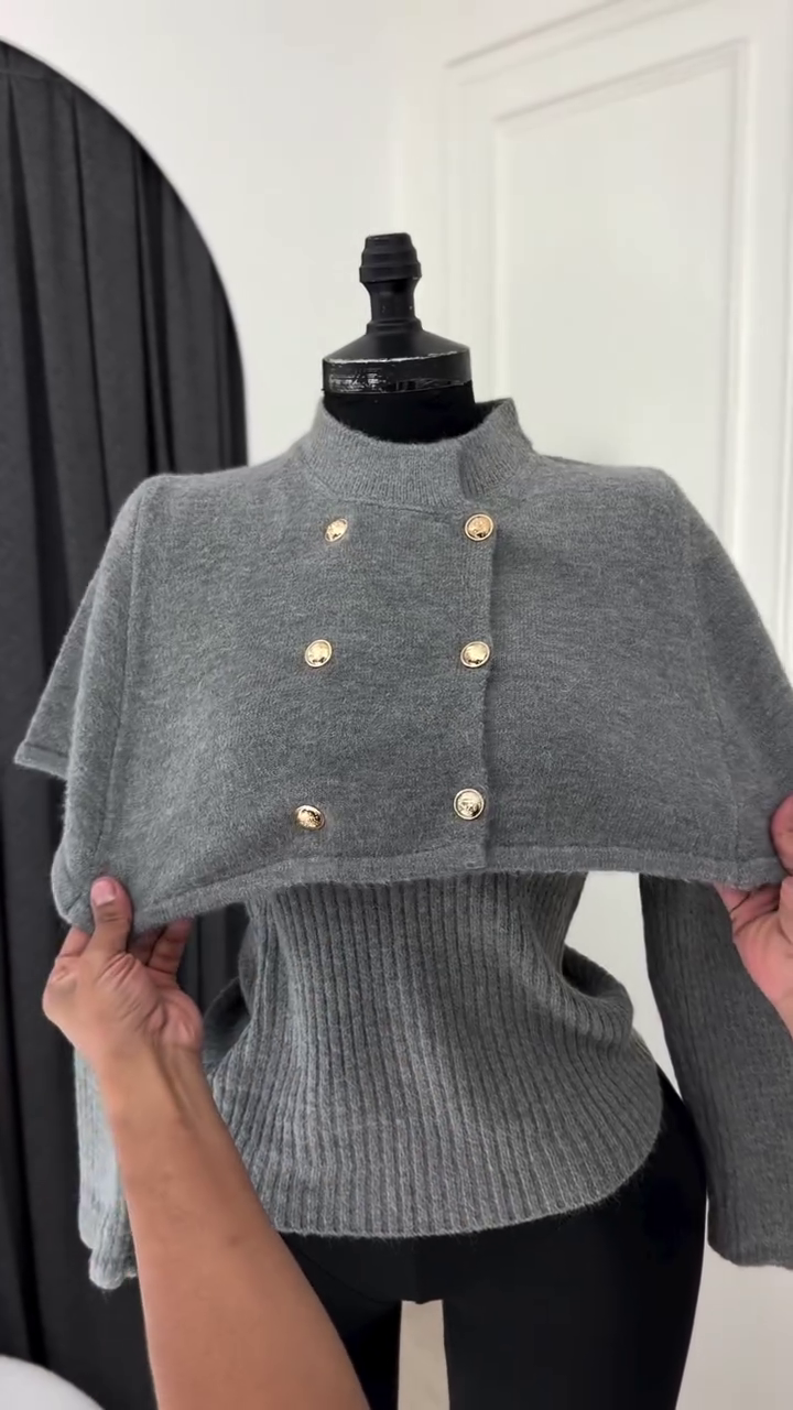 Elegant Grey Double-Breasted Knit Two-Piece Sweater Set Featuring a Short Capelet Overlay with Gold-Toned Metallic Buttons and a Matching Ribbed Long-Sleeve Under Top